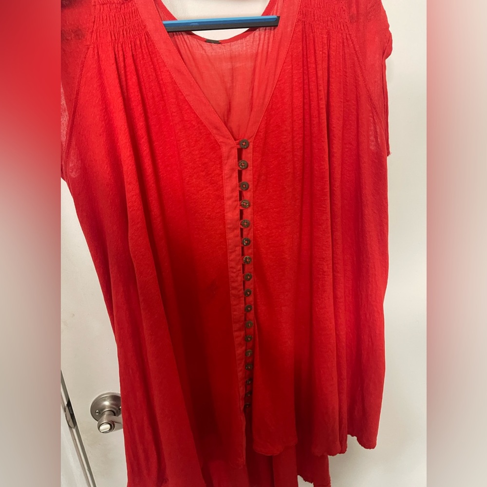 In good condition red free people blouse with buttons.